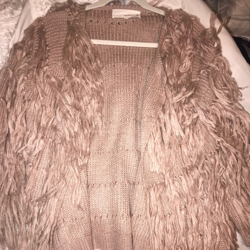 A light pink/purple fluffy cardigan